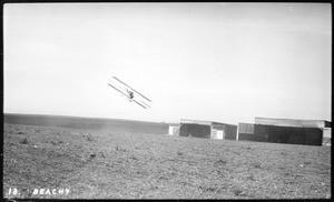 Aviator Lincoln Beachey performing a stunt in his airplane at the Dominguez Hills Air Meet, 1912