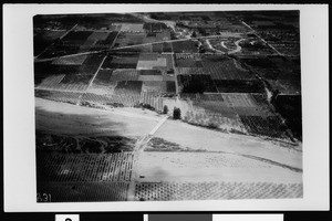 Aerial view of a flooded area at the Seventeenth Street bridge near Santa Ana, 1938