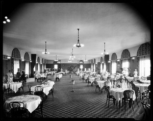 Workers preparing tables for a banquet