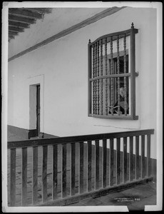 Mission Santa Barbara, showing view from outside of Monk reading book inside, California, 1898