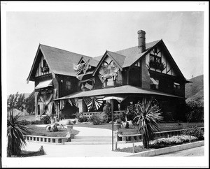 View of a house on the corner of Hollywood Boulevard and El Cerrito Place, possibly the Grass residence