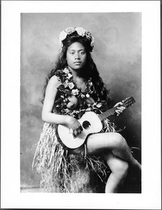 Portrait of a bare-breasted native girl musical entertainer, Hawaii