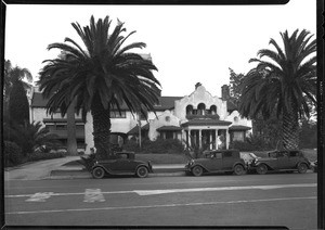 Exterior view of the residence of Colonel Harrison Gary Otis, site of the Otis Art Institute, showing parked automobiles, 1929