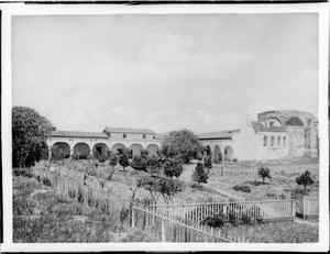 South side of Mission San Juan Capistrano, taken from outside fence, ca.1900