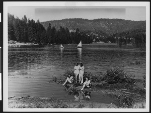 Women along a lake shoreline, ca.1930