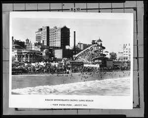 Beach-goers in the surf in front of the Long Beach Pier, ca.1925