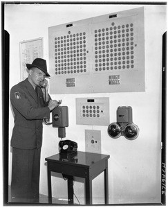 Man speaking on a phone at Terminal Island Federal Prison