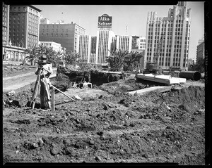 Surveyor at work during the construction of the City Garage in Los Angeles's Pershing Square, 1951