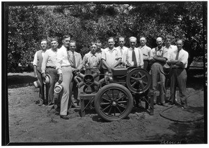 Group of men posing around an aeroculator in Covina, ca.1930