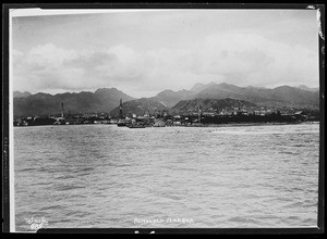 Distant view of Honolulu harbor from the ocean