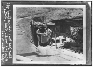 Mouth of Black Jack Mine on Black Jack Mountain on Santa Catalina Island, showing three miners, October 16, 1935