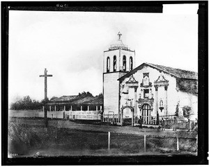 Exterior view of the Mission Santa Clara from the road, ca.1900