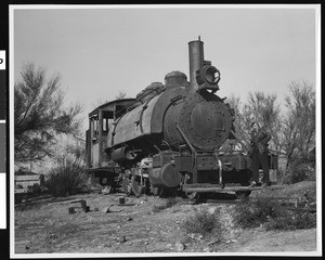 View of Tecopa Railroad engine connected with Tonopah and Tidewater (near Gunsite Mine?), ca.1900-1950