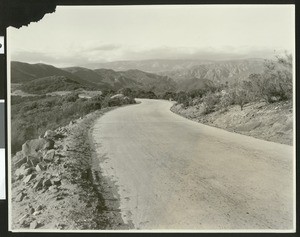 View of the Ridge Route Highway showing a flat grade near the mountain cliff, Southern California