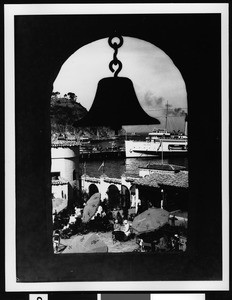 Portion of Avalon Bay from behind a hanging bell, ca.1930