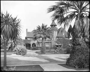 Exterior view of the E.L. Doheny mansion from across the street, on Chester Place, Los Angeles, 1910