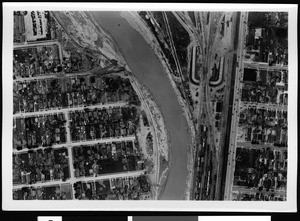 Aerial view of unidentified flooded area, showing river curving to the left, 1938