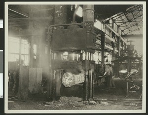 Several men at the National Supply Company factory interior, ca.1930