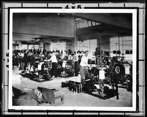 View of men at work in a Los Angeles garment factory, ca.1928