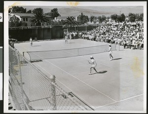 Women's doubles tennis match, ca.1930