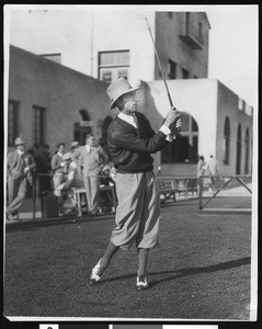 Tommy Armour swinging an iron golf club at the Los Angeles Open Golf Tourney at the Riviera Country Club, ca.1930