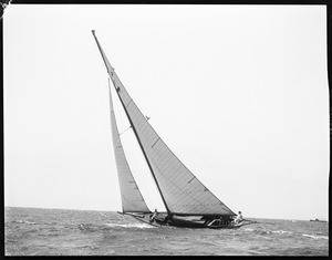 Single yacht manned by two people at the Los Angeles Harbor