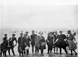 Portrait of thirteen visitors at Long Beach modeling their bathing suits, Los Angeles, ca.1910