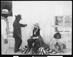 George Wharton James taking notes in a small notebook, Kingman, Arizona, ca.1902