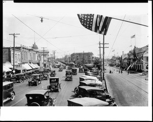 View of cars moving down streets in the Pike, an amusment area for Redondo Beach tourists, ca.1924