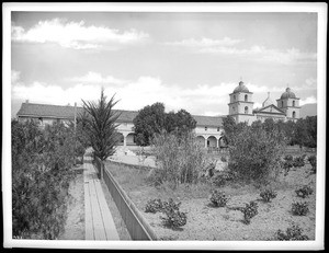 Mission Santa Barbara, showing south front from garden at west end, California, 1898