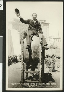 Sailor atop an Austrian floating mine at the World War I Allied War Exposition in Los Angeles, August 1-10, 1918