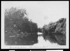 View of people along the shore at boating place in Redding