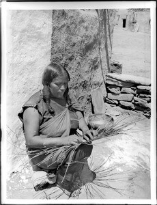 Hopi Indian woman basket maker, ca.1900