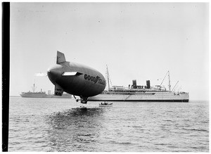 Passengers transferring from a ship to the Goodyear Blimp in Los Angeles Harbor