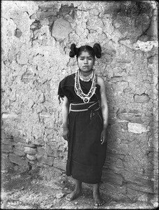 Hopi maiden wearing rich silver jewelry and wampum, Arizona, 1898