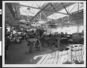 Busy unidentified aircraft assembly line, ca.1940