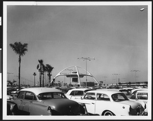 View of the parabolic arches of the Los Angeles International Airport from a parking lot, in November 1961