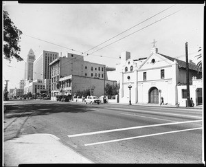 Exterior view of the Nuestra Senora la Reina de Los Angeles church from the north end of the Los Angeles Plaza, March 17, 1960