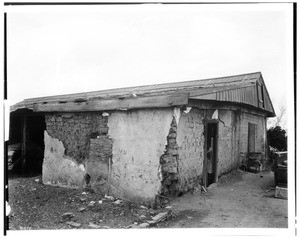 Exterior view of the Casa de Don Dolores Sepulveda in disrepair, taken from the front, ca.1933