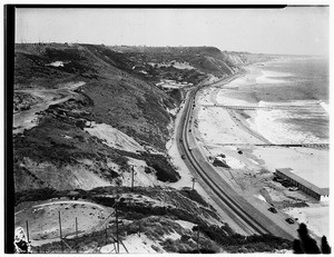 Birdseye view of three piers along Pacific Coast Highway between Malibu and Santa Monica