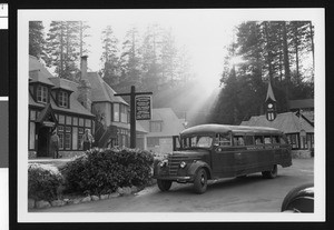 Large bus parked in front of the administration building, Lake Arrowhead, ca.1950