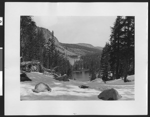 Lake as seen from snow-covered ridge above