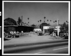Standard Service station being remodeled, showing both old and new, 1971