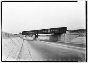 View of a two lane road with a concrete divider