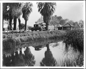 View of the pond and area around an Indian-owned bath house in Palm Springs, ca.1934