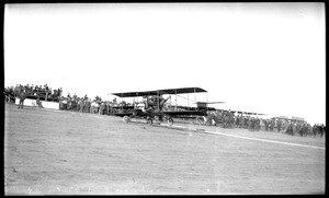 Lincoln Beachey in his biplane as the "mysterious woman aviator" at the Dominguez Hills Air Meet, 1912