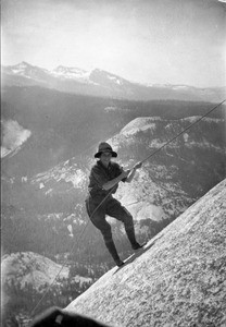 Mountain climber climbing Half Dome in Yosemite National Park, ca.1930