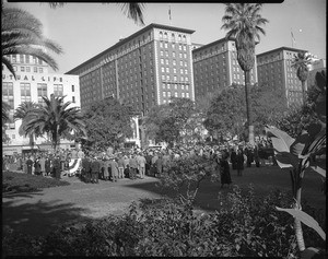 Crowd listening to a speaker at the groundbreaking ceremony for the Pershing Square parking garage, 1951