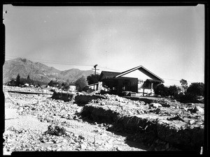 Exterior view of homes damaged by a flood, La Crescenta, January 1, 1934