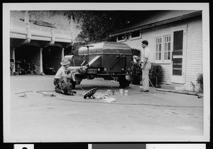 Night emergency crew painting sewer cleaning machine